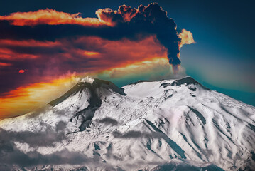 Epic eruption of Mount Etna - Snowcapped volcano - the highest active volcano in Europe. Burst of ash and fire, top craters