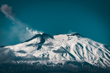 snow covered peaks of Mount Etna - the highest active volcano in Europe 