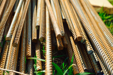 close-up - a pile of iron bars lying on the grass