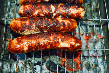 close-up - delicious grilled sausages with appetizing crust