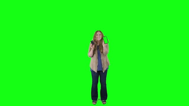 Shopper shows credit card and cellphone celebrating on green screen