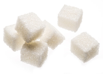 White sugar cubes on white background. Macro picture.