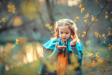 Litlle girl in a spring forest