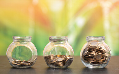 money in a glass bottle