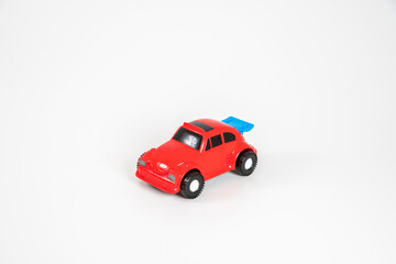 Toy plastic car isolated on white background. Red car.