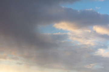 Rain clouds in the sky at sunset