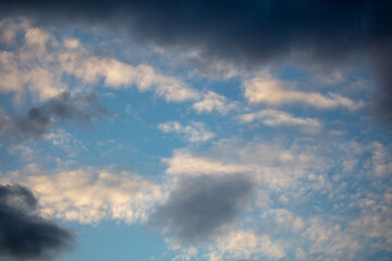 Rain clouds in the sky at sunset