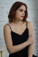 Fototapeta premium Photo of a young beautiful girl in a photo studio