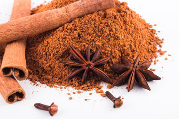 anise stars and cinnamon sticks isolated on white background stock photo