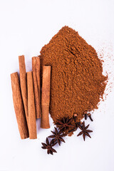 anise stars and cinnamon sticks isolated on white background stock photo