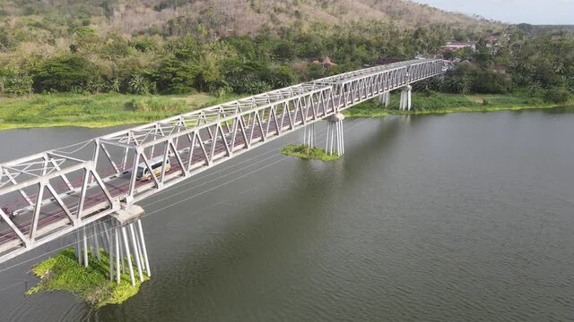 Aerial of long steel bridge in Kretek village, Yogyakarta, Indonesia