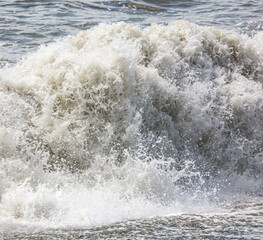 Splashing big waves on the seashore.