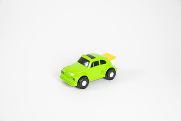 Toy plastic car isolated on white background. Light green car.