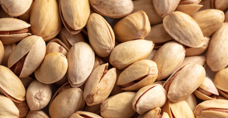 Fototapeta premium Close-up of fresh pistachio nuts as background.