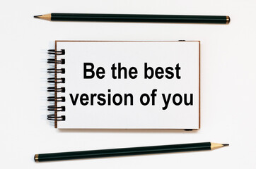 WHITE SPIRAL NOTEBOOK, TWO PENCILS WITH TEXT Be the best version of you