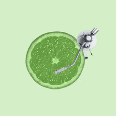 Contemporary art collage, modern design. Summer mood. Media player made of lime green and juicy slice on green