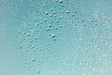 Drops of water on a blue glass window