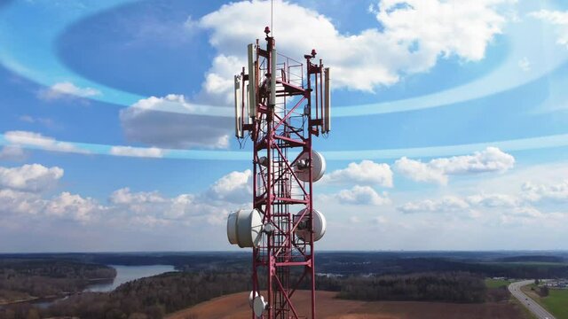 Aerial drone view around of the telecommunication tower. Animated visualization of mobile network signals originating from a cell tower. 5g cellular mobile wave signal transmission.