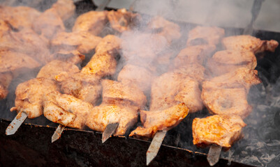 Meat on skewers is fried