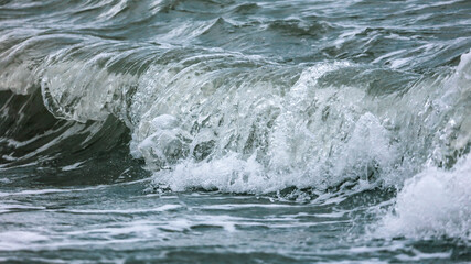 Wave in the sea with splashing water.