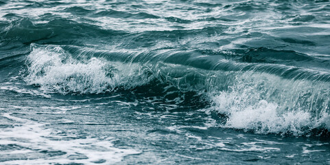 Wave in the sea with splashing water.
