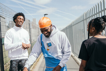 Group of friends standing together and laughing