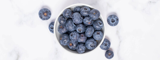 Blueberry in a bowl banner, marble and white backgorund