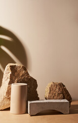 Beige stone and a piece of grey podium tile on a beige background, natural background with shadow...