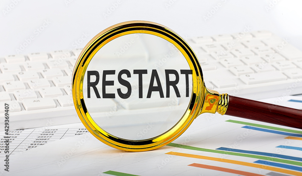 Poster magnifying glass with the word restart on the chart background