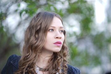 Portrait of a young beautiful girl in the park