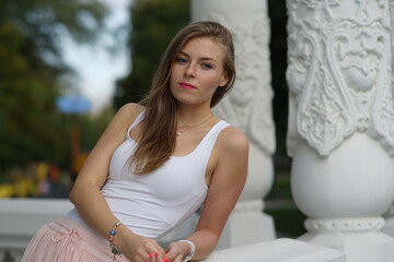 Portrait of a young beautiful girl in the park