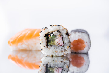 maki, tekkamaki and niguiri, nigiri on white background, sushi