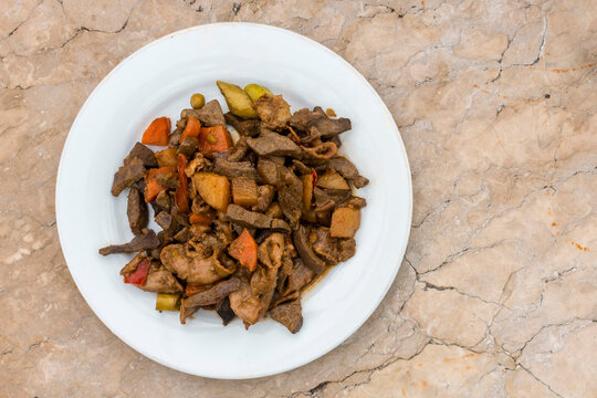 Igado, a Filipino spiced pork dish made with liver, tenderloin, innards and vegetables. Ilocano cuisine.