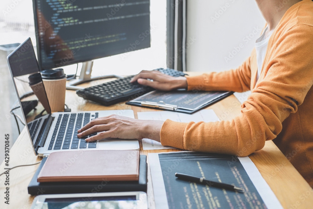 Aufkleber young professional programmer working at developing programming and website working in a software de