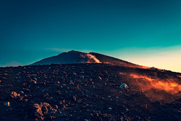 Haze at the top of Mount Etna by sunset 