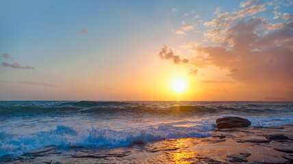 Fototapeta na wymiar Power sea wave breaking on the shore at sunset - Alanya, Turkey