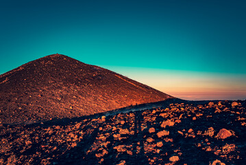 The top crater of Mt Etna (Crateri Sommitali) at sunset. Warm light, teal sky. Teal and orange...