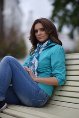 Obraz premium Portrait of a young beautiful girl in the park