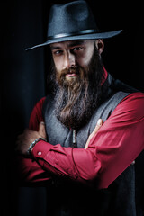 Serious man with beard in hat