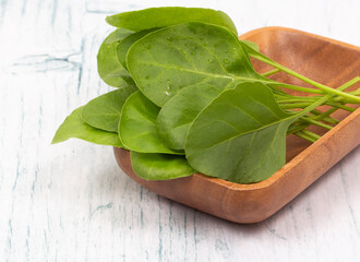 Fresh spinach leaves in bowl