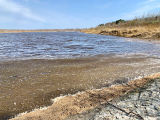 A water-filled sand pit in the spring. Orekhovo-Zuyevsky district, Moscow region, Russia