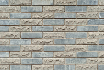 Plaster on a yellow wall. Concrete wall texture close up.