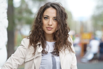 Fototapeta premium Portrait of a young beautiful girl in the park