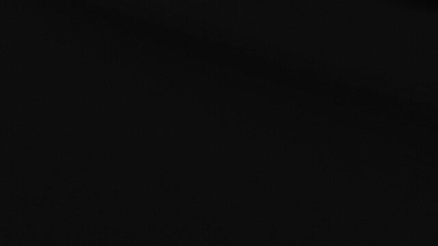 Plain black flag waving in the wind, minimalist design