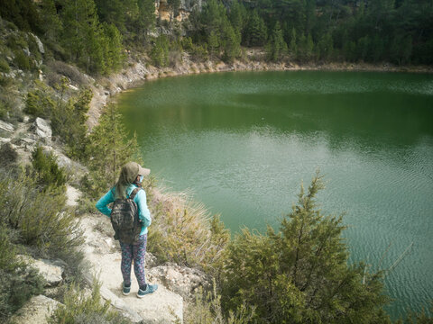 photograph of hiker next to the torca lagoon in Cuenca, Castilla La Mancha, Spain,