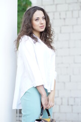 Portrait of a young beautiful girl in the park