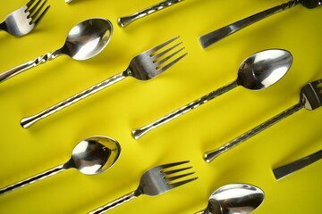 sliver wares spoon and fork on bright background