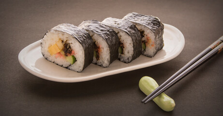 Japanese cuisine. Sushi on a plate.  Japanese foods. Norimaki.