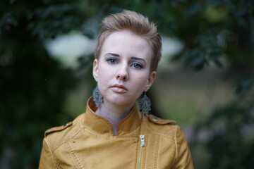 Portrait of a young beautiful girl in the park