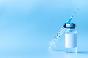 Vaccination concept. Vaccine vial dose with with syringe